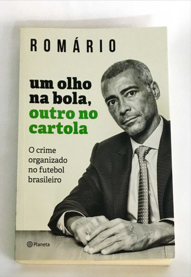 <a href="https://www.touchelivros.com.br/livro/um-olho-na-bola-outro-no-cartola-o-crime-organizado-no-futebol-brasileiro/">Um Olho na Bola, outro no Cartola – O Crime Organizado no Futebol Brasileiro - Romário</a>