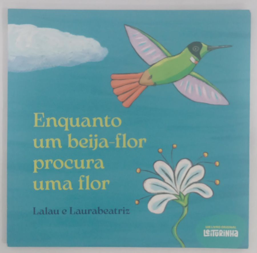 <a href="https://www.touchelivros.com.br/livro/enquanto-um-beija-flor-procura-uma-flor/">Enquanto Um Beija-Flor Procura Uma Flor - Lalau e Laurabeatriz</a>