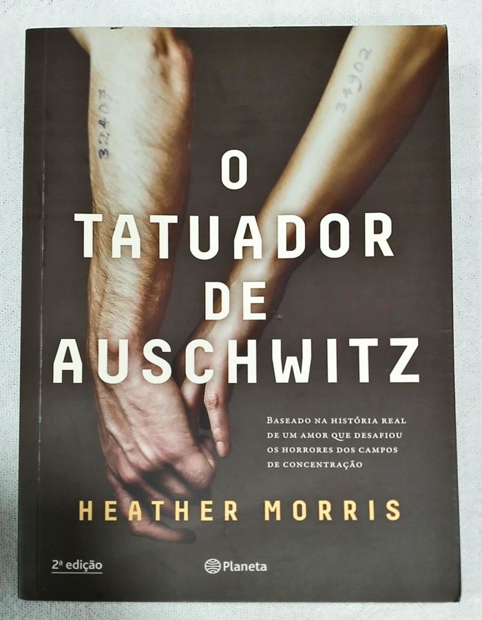 <a href="https://www.touchelivros.com.br/livro/o-tatuador-de-auschwitz/">O tatuador de Auschwitz - Heather Morris</a>